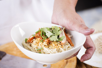 Chef present egg Noodle with roast chicken