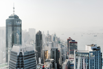 View of skyscrapers in business center of Hong Kong city and Vic - obrazy, fototapety, plakaty