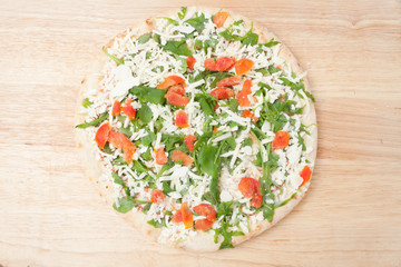 frozen pizza on wooden board