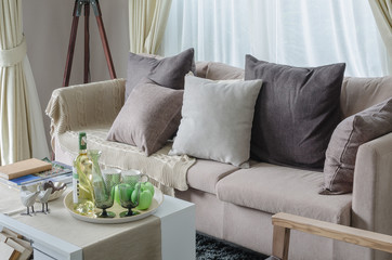 pillows and blanket on earth tone sofa