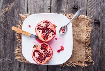 Pomegranate on old wooden table