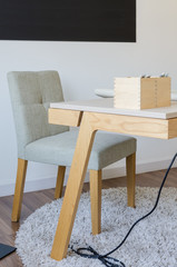 modern wooden working desk with chair on carpet