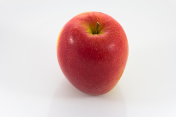 Red ripe apple on plate