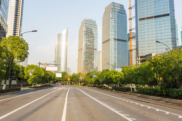 Fototapeta na wymiar skyline,urban road and office building at daytime.