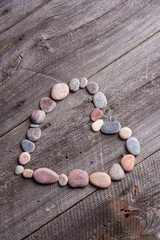 Stone heart on wooden table