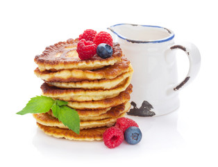 Pancakes with raspberry, blueberry and milk