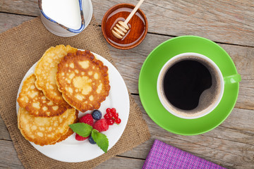 Pancakes with raspberry, blueberry, milk and honey syrup