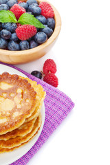 Pancakes with raspberry, blueberry, mint and honey syrup