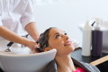 happy young woman at hair salon
