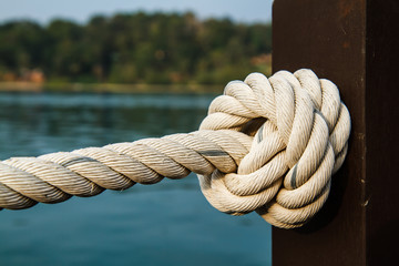 Fototapeta premium White rope tied into a knot.