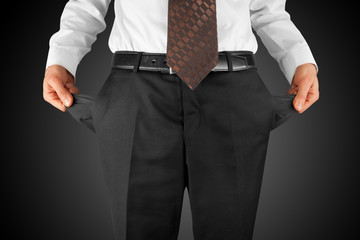 man showing empty pockets