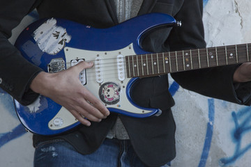 playing guitar in foreground