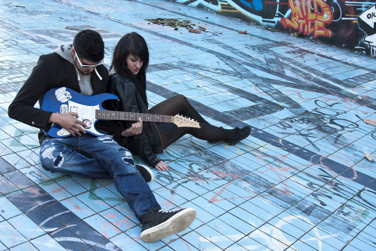 couple with electric guitar