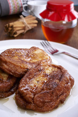 Fototapeta na wymiar French toast on a plate, and bottom cinnamon, honey and coffee