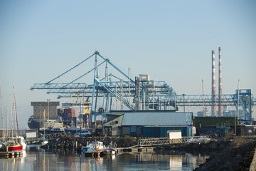 Fototapeta na wymiar Commercial harbor with large industrial cranes