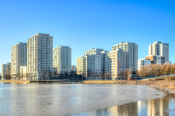 Helsinki city scape reflecting on a frozen ocean bay