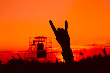 people celebrating on an open air shillouettes