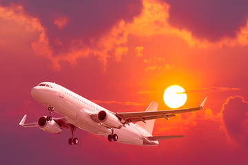 air plane flying with sunset