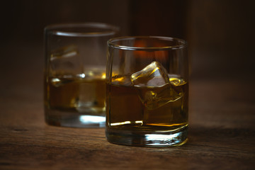 shot of whiskey on old wooden surface