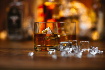 Whiskey drinks on wood