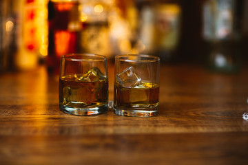 Whiskey drinks on wood