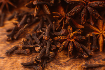 Cinnamon sticks with anise star on wooden background