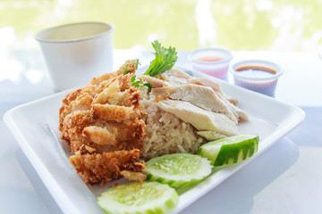 fried and stream chicken with oil rice and spicy sauce