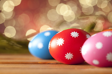 Colored Easter eggs on wooden planks