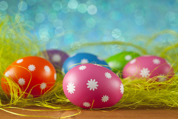 Colored Easter eggs on blue background