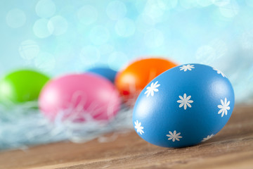 Colored Easter eggs on blue background