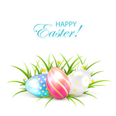 Three Easter eggs with grass