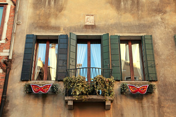 Fototapeta na wymiar Traditional windows of typical old Venice building ,Italy.