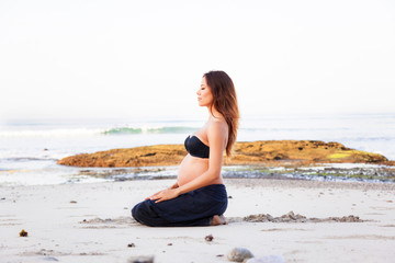 Fototapeta na wymiar pregnant woman in a Yoga Breathing Position