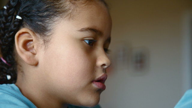 young girl at home talking and smiling in camera