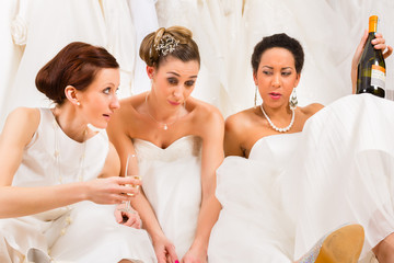 Brides drinking too much in wedding shop or store