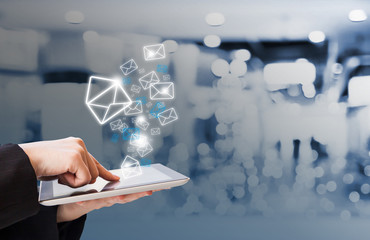 Business woman sending email in the shopping mall