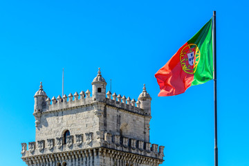 Belem Tower and flag of Portugal in Lisbon