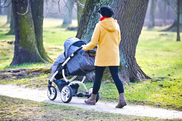 Young mother with  pram - 79917974