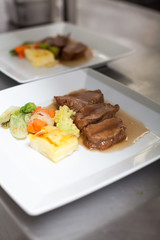 Chef plating up food in a restaurant