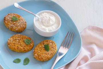Healthy vegetable cutlets with carrot, breaded in oat bran