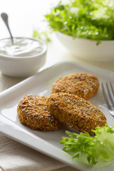 Healthy vegetable cutlets with carrot, breaded in oat bran