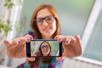Hipster Female Taking Selfie