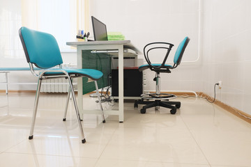 The image of an empty doctor's consulting room