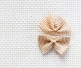 Italian bows farfalle pasta from durum wheat,  top view