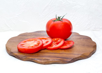 cutting board and red tomato