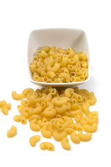 Italian pasta in a porcelain bowl on white background