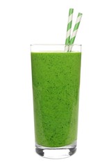 Green smoothie in a glass with straws isolated on white