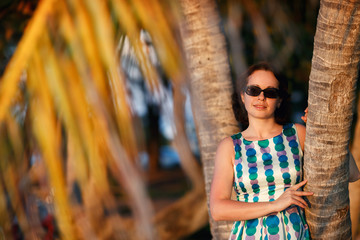 Young woman admires sunset