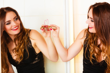 Woman drawing heart on mirror.