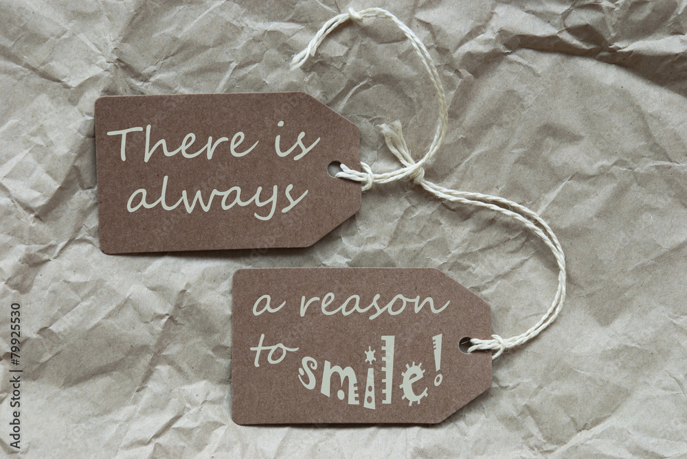 Wall mural two brown labels with quote always reason smile paper background